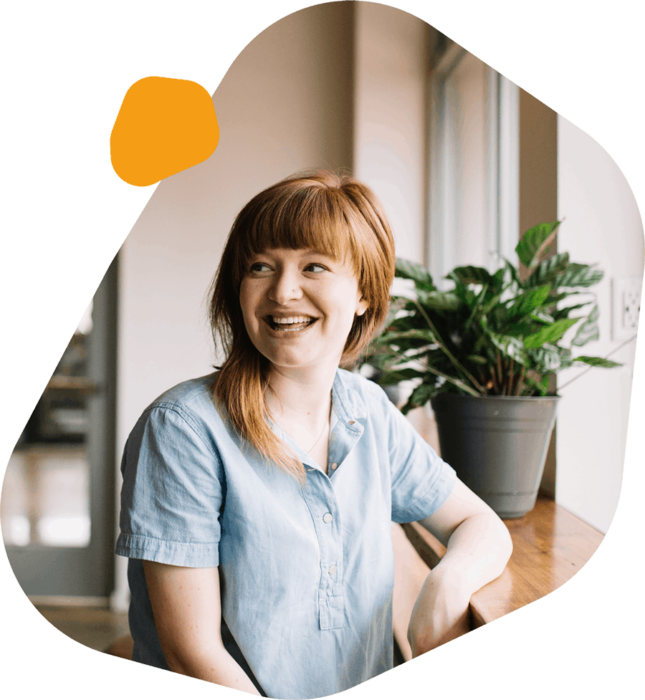 Homepage Happy Female Employee w Orange Blob