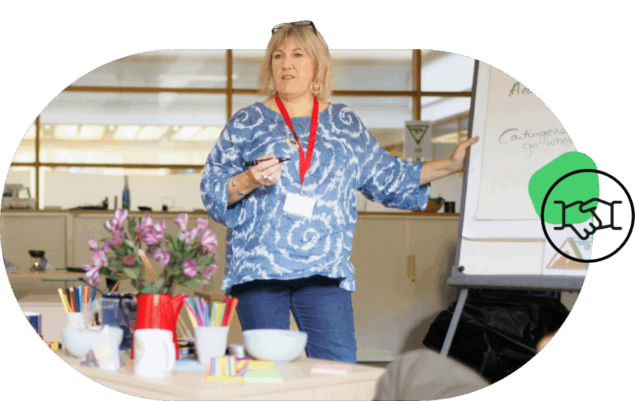 Image of a person leading a workshop accompanied by the Hive Professional Services icon